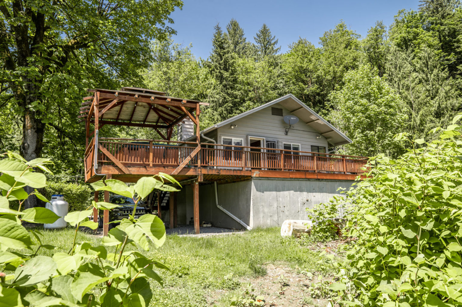 Soak Up Summer with the Ultimate River Views and Hot Tub in this ...