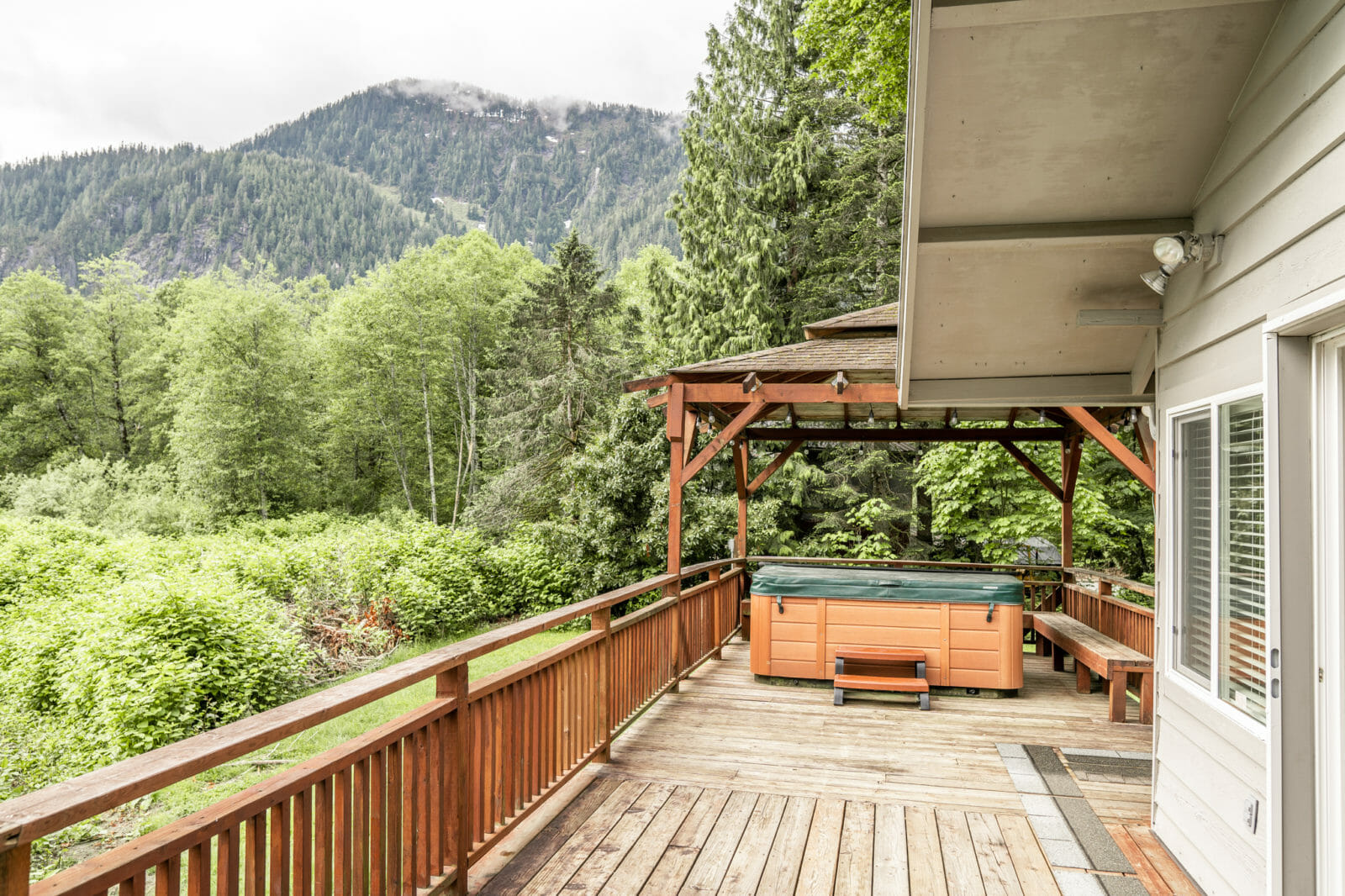 Soak Up Summer With The Ultimate River Views And Hot Tub In This