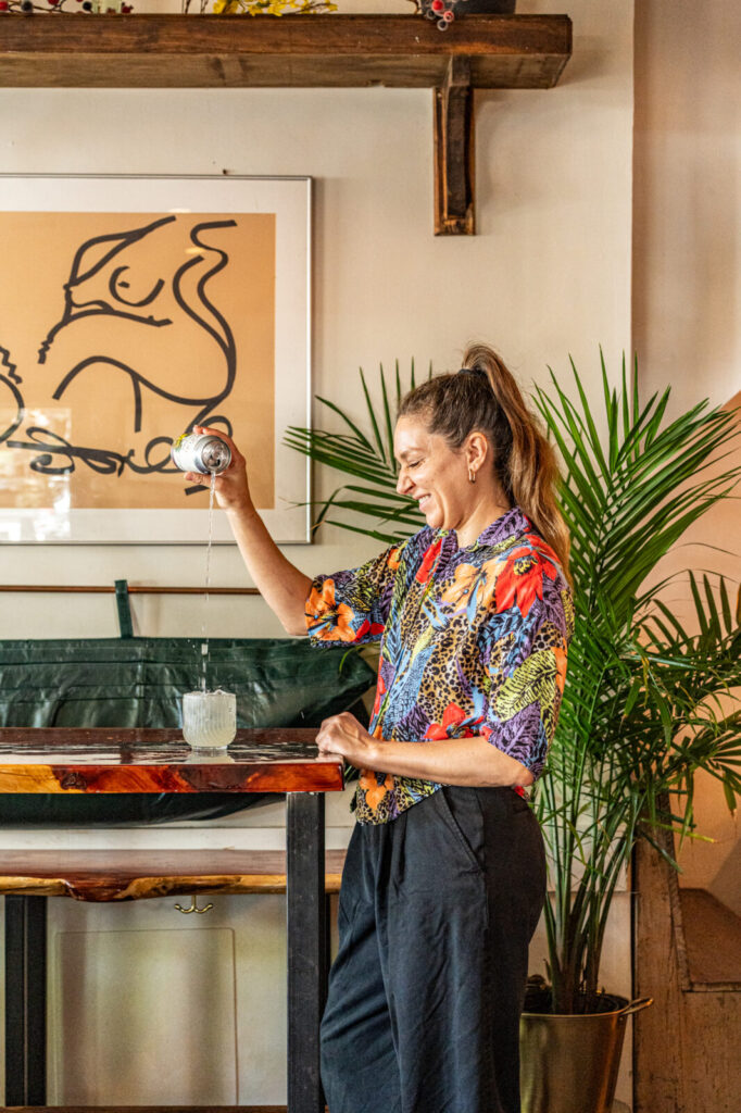 Vassiliki Ellwood Yiagazis pouring a St. Rains into a glass at Smoke & Honey in New Orleans